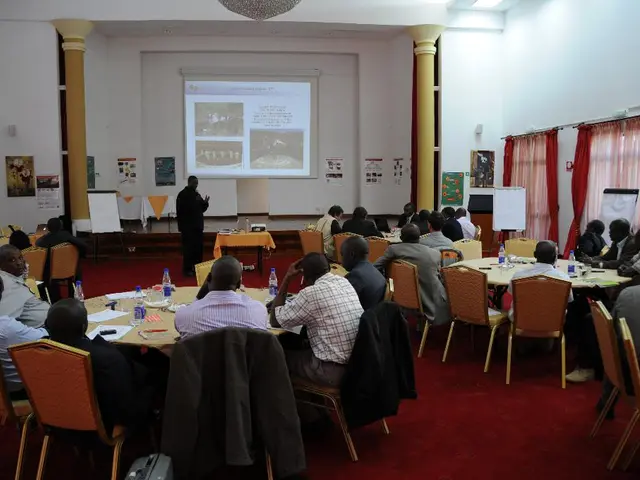 In this picture it seems to be conference meet, there are different table, the people those who are...